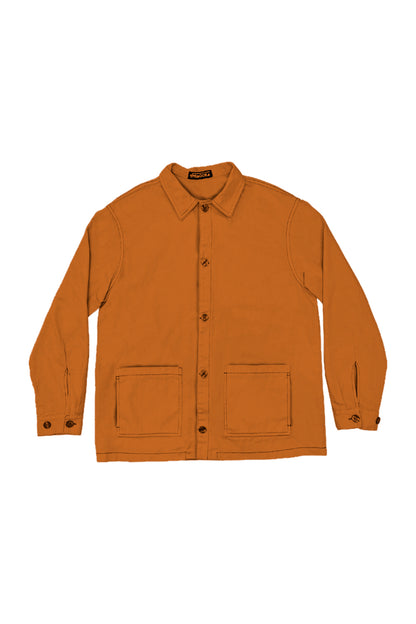 sobrecamisa unisex en color naranja oxido en algodón orgaíco con botones en tinta y bolsillos y cierre con botones y botones en el cierre doble de las mangas